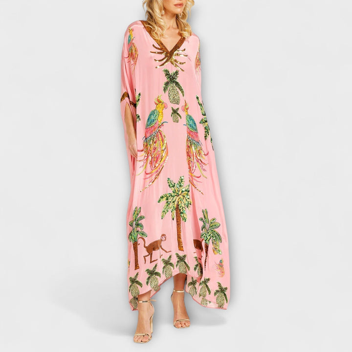 Linda - Impresionante vestido con tirantes asimétricos y estampado de palmeras